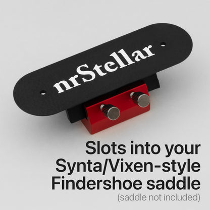 nrStellar MeLE Findershoe Dovetail installed in a red Findershoe saddle. Text reads "Slots into your Synta/Vixen-style findershoe saddle. (Saddle not included)."