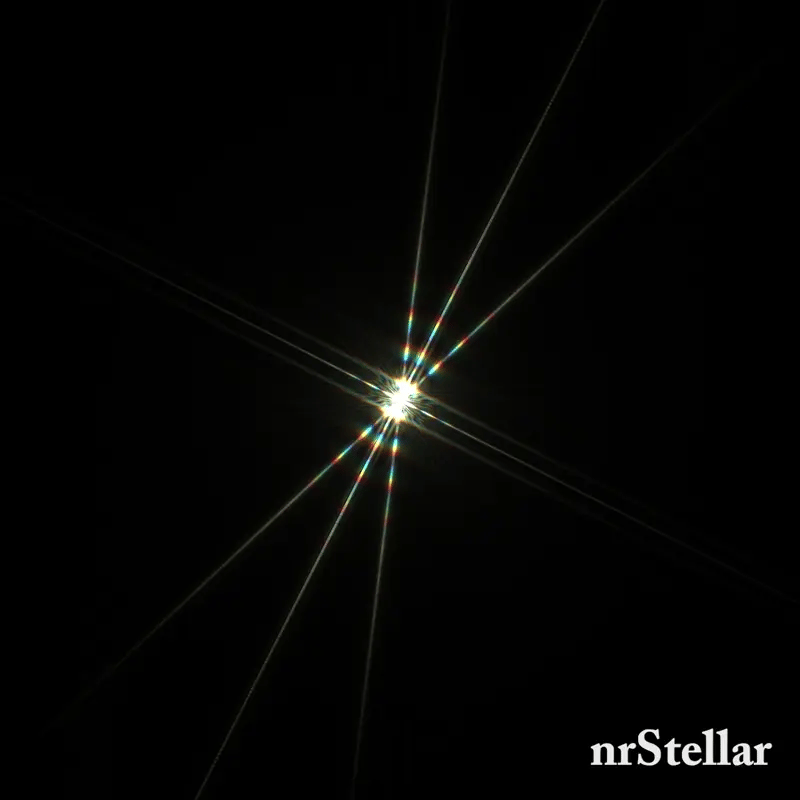 A star through a Bahtinov mask as the focus moves in and out of critical focus