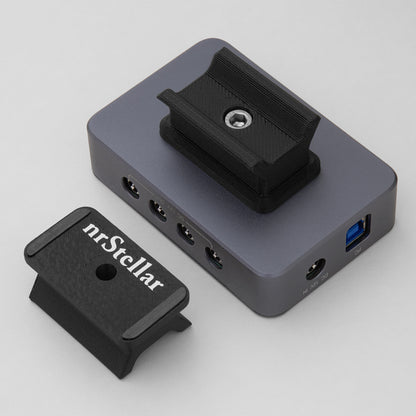 An nrStellar SV241 finderscope dovetail installed on an SVBONY powerbox. Next to it is another nrStellar SV241 finderscope dovetail, upside down to display the rubber padding and brand name.