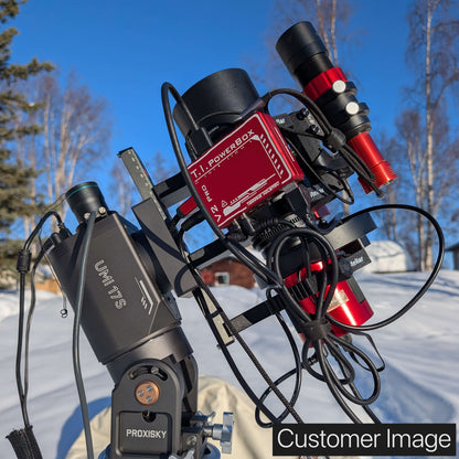 A Rokinon 135mm f2 Cinema Lens mounted in the nrStellar Rokinon/Samyang 135 Ring System. An autofocuser, guidescope, filterwheel, power box, and astronomy camera are also installed. Text reads "Customer Image'